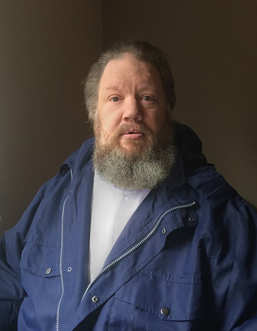 A person with a beard
AI-generated content may be incorrect.